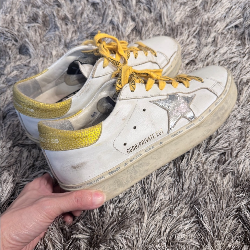 Golden Goose White Sneakers with Yellow Accents and Silver Star